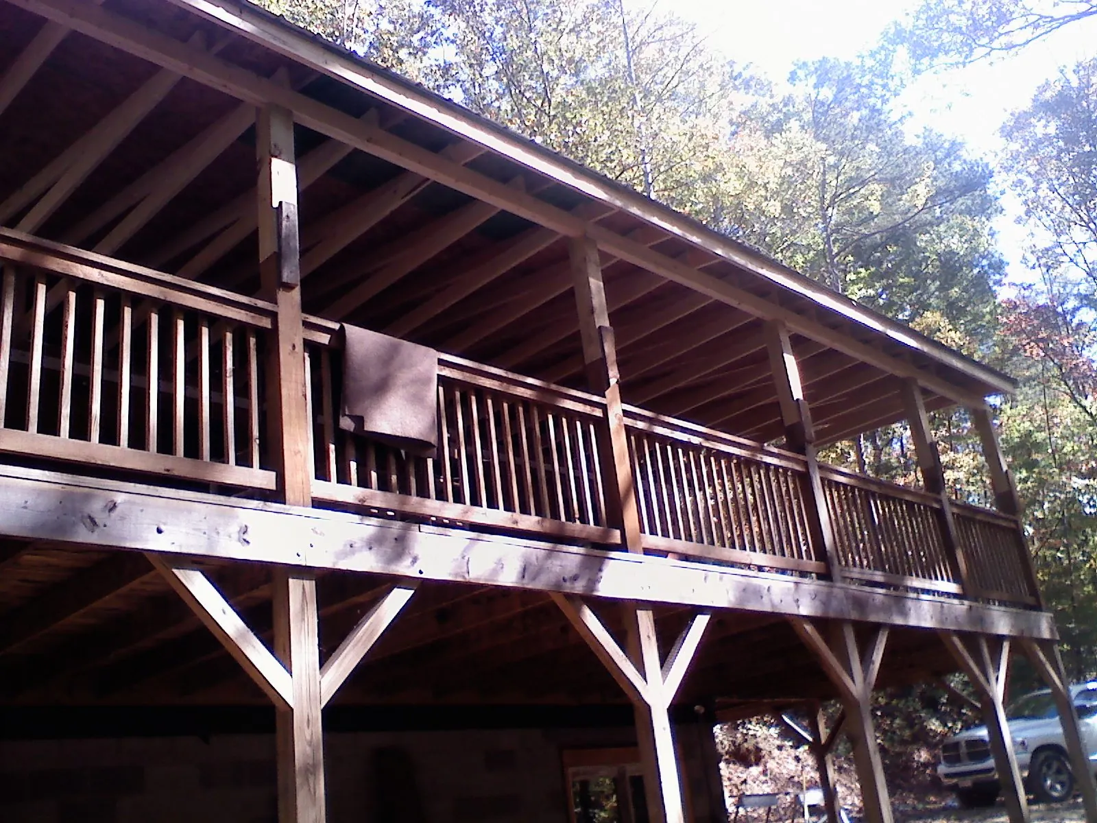 Timber framing under a new elevated porch and deck — Roof Leak Repair in Issue by Roofing Brothers